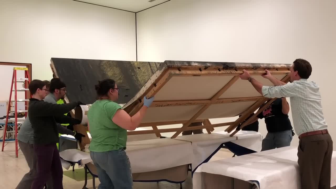 How to squeeze a giant painting through the door